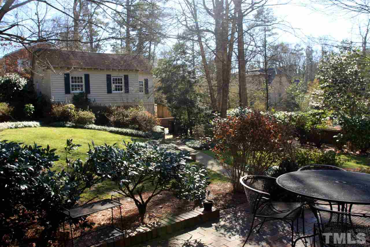 3117 Georgian Terrace Raleigh, NC 27607 - Photo 24 of 25 a backyard of a house with yard and outdoor seating