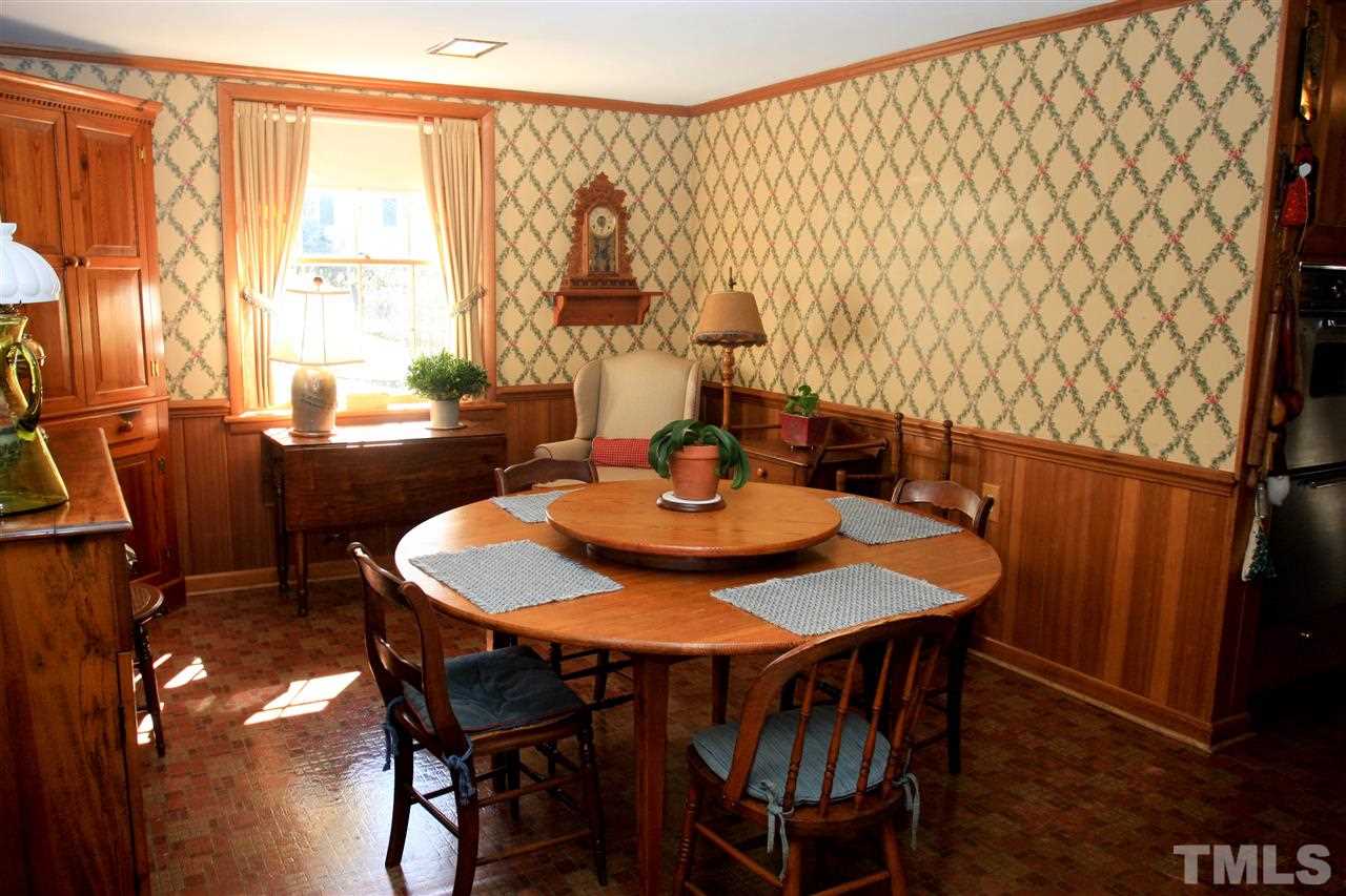 3117 Georgian Terrace Raleigh, NC 27607 - Photo 6 of 25 a view of a dining room with furniture window and wooden floor