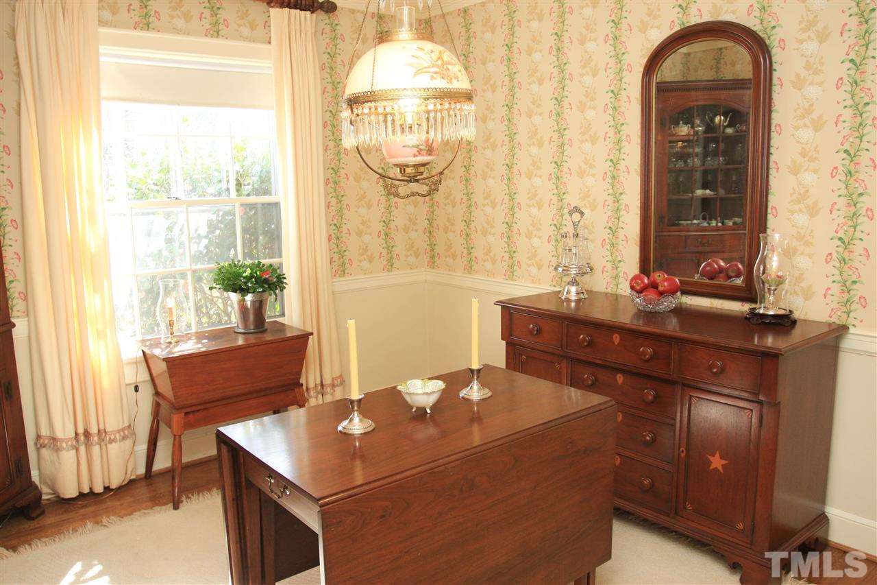 3117 Georgian Terrace Raleigh, NC 27607 - Photo 8 of 25 a room with a window and a table