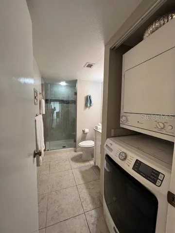 a spacious bedroom with two beds and a couch