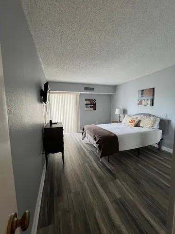 a room with furniture and a flat screen tv