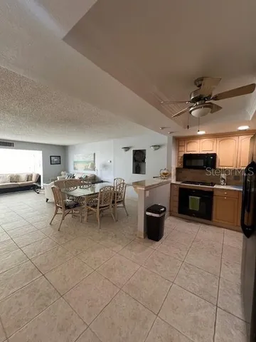 a terrace with a table and chairs