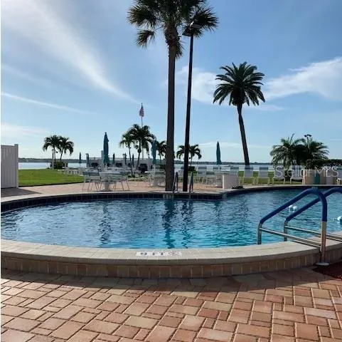 a front view of a lake with outdoor seating
