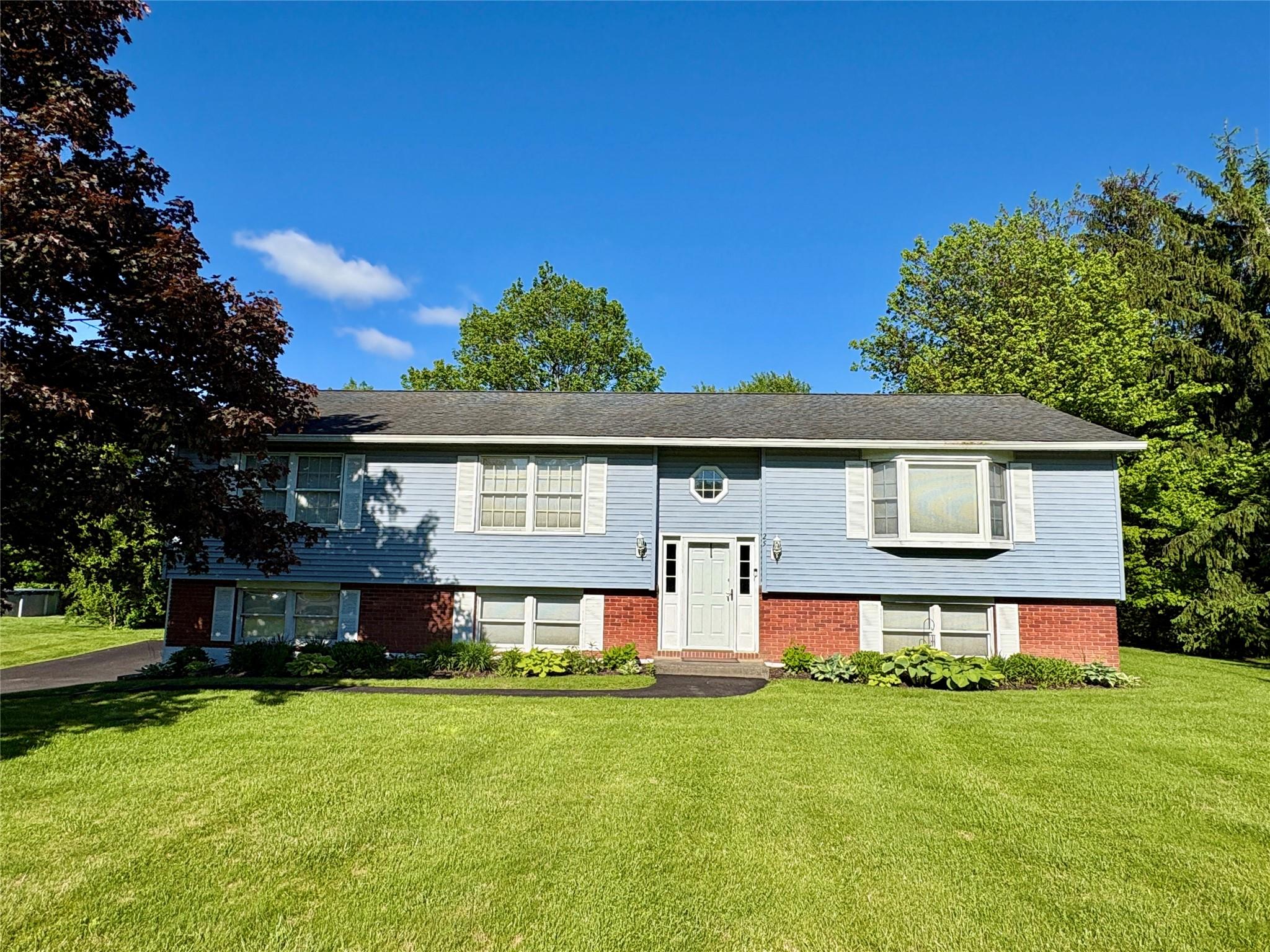 front view of a house with a yard