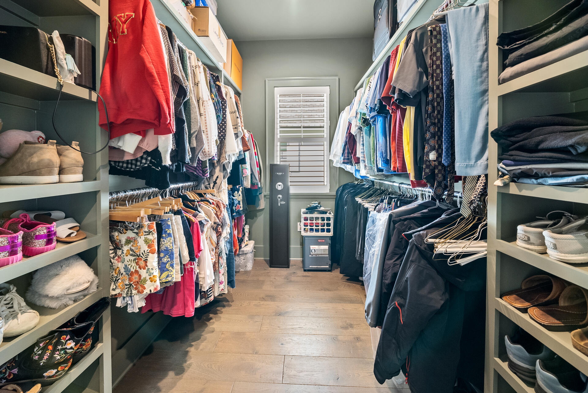 257 Moonlit Way Destin, FL 32541 - Photo 24 of 62 a view of walk in closet with clothes and shoes