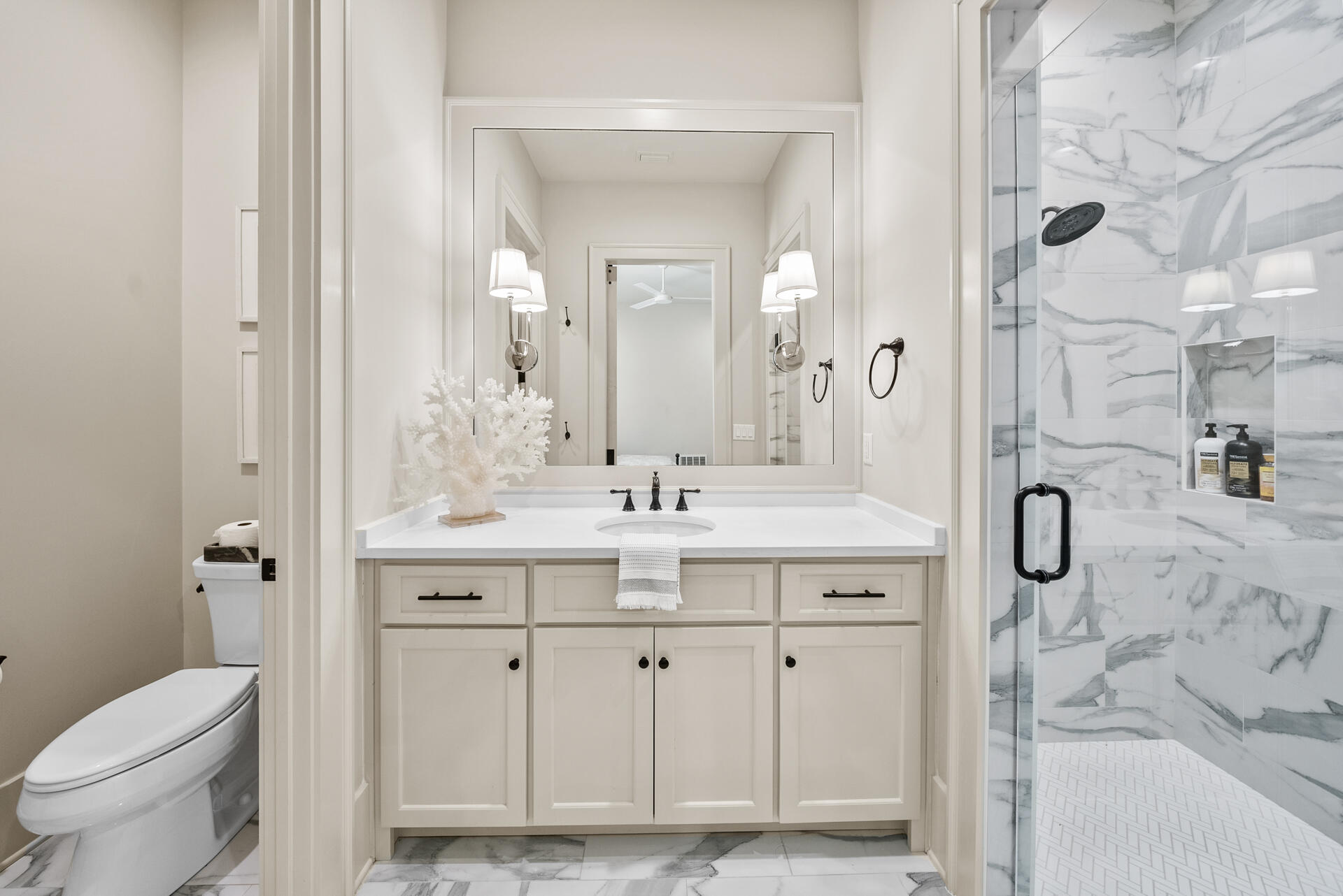 257 Moonlit Way Destin, FL 32541 - Photo 30 of 62 a bathroom with a granite countertop sink toilet and shower