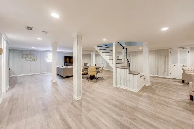 a view of an empty room and wooden floor