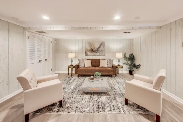 a living room with furniture and a rug