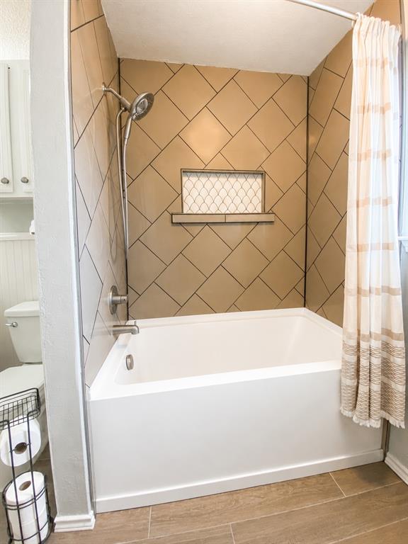 404 Old Mansfield Road Keene, TX 76059 - Photo 17 of 33 Tub/Shower from doorway to primary bedroom
