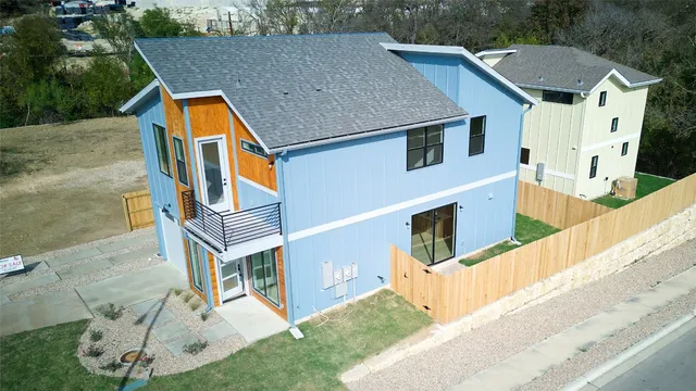 a aerial view of a house with a yard