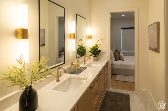5366 Cyan Lane St. George, UT 84790 - Photo 3 of 39 Ensuite bathroom featuring double vanity and baseboards