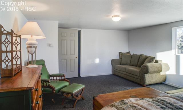 1095 Doe Valley Road Guffey, CO 80820 - Photo 18 of 21 There are 2 upper level rooms. Current owners made this their sitting/sleeping area.