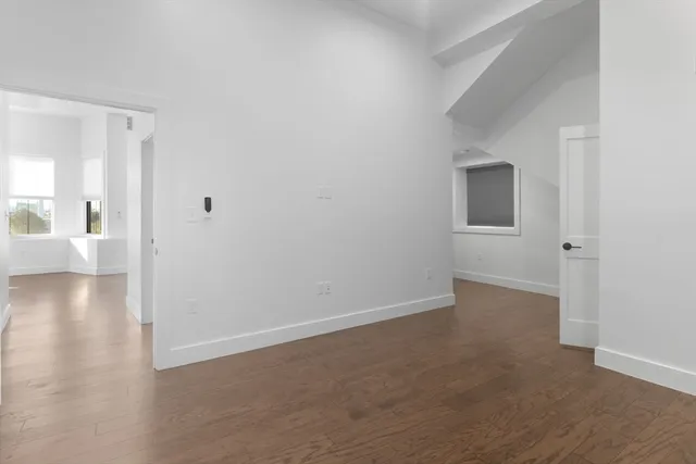 a view of a livingroom with an empty space and a workspace