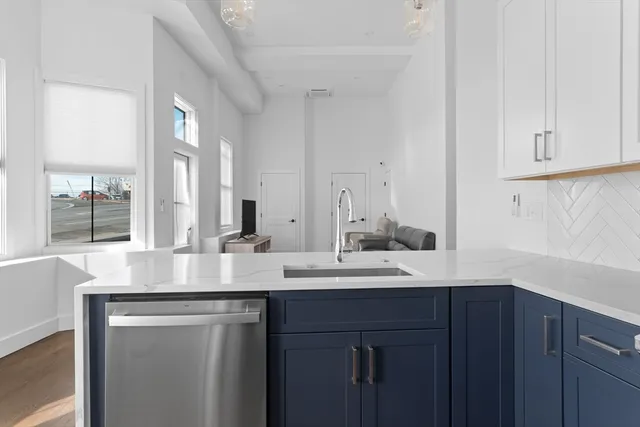 a kitchen with a sink and cabinets