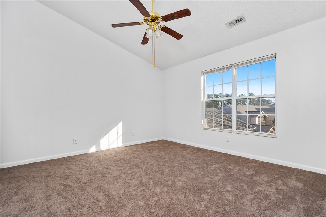 151 Wexford Drive, Unit 301 Anderson, SC 29621 - Photo 18 of 29 This spacious bedroom offers high ceilings and a bright window for a comfortable retreat.