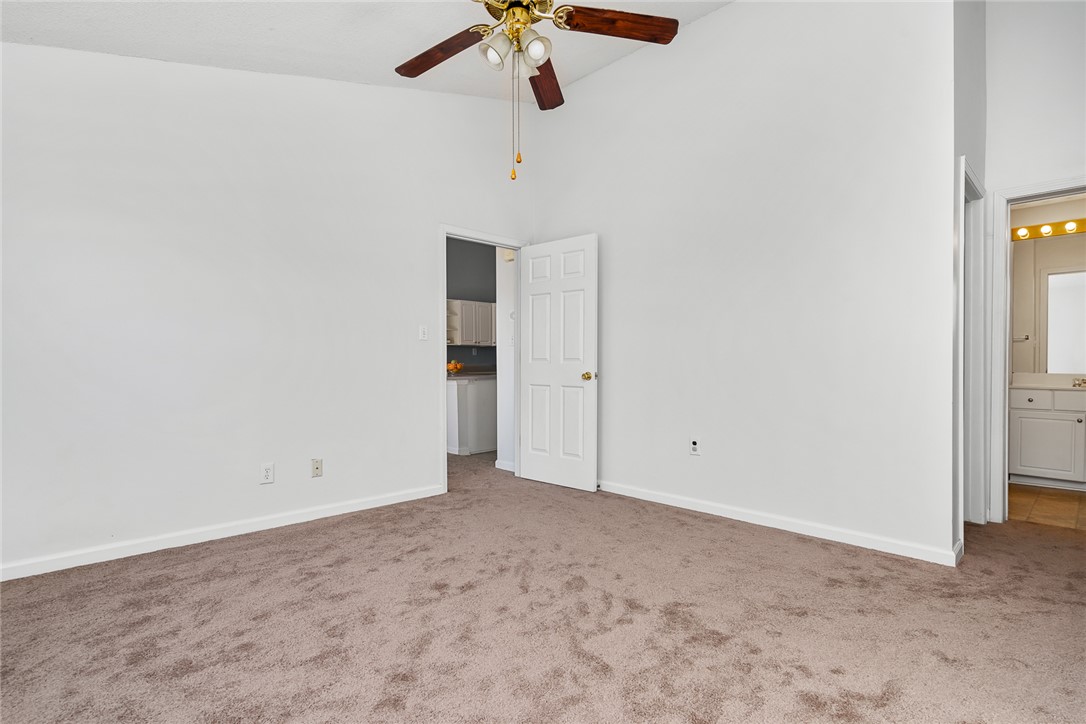 151 Wexford Drive, Unit 301 Anderson, SC 29621 - Photo 19 of 29 This airy bedroom features high ceilings and soft carpeting, creating a tranquil retreat.