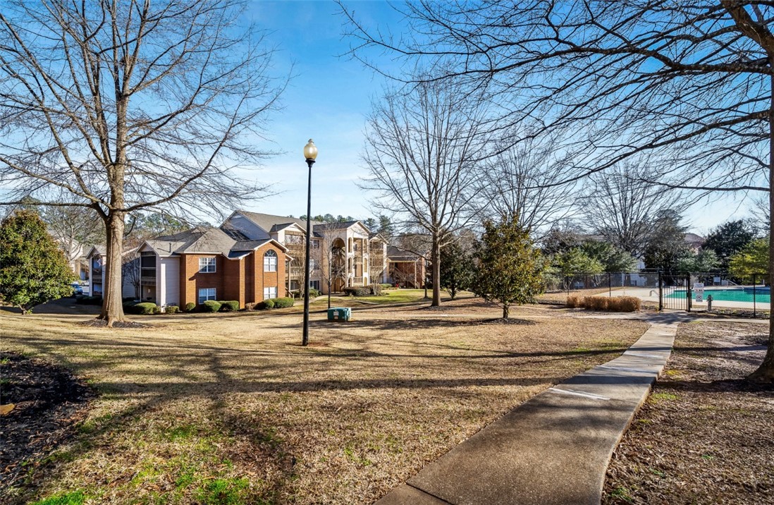 151 Wexford Drive, Unit 301 Anderson, SC 29621 - Photo 26 of 29 This residential complex features mature landscaping and a well-maintained community pool.