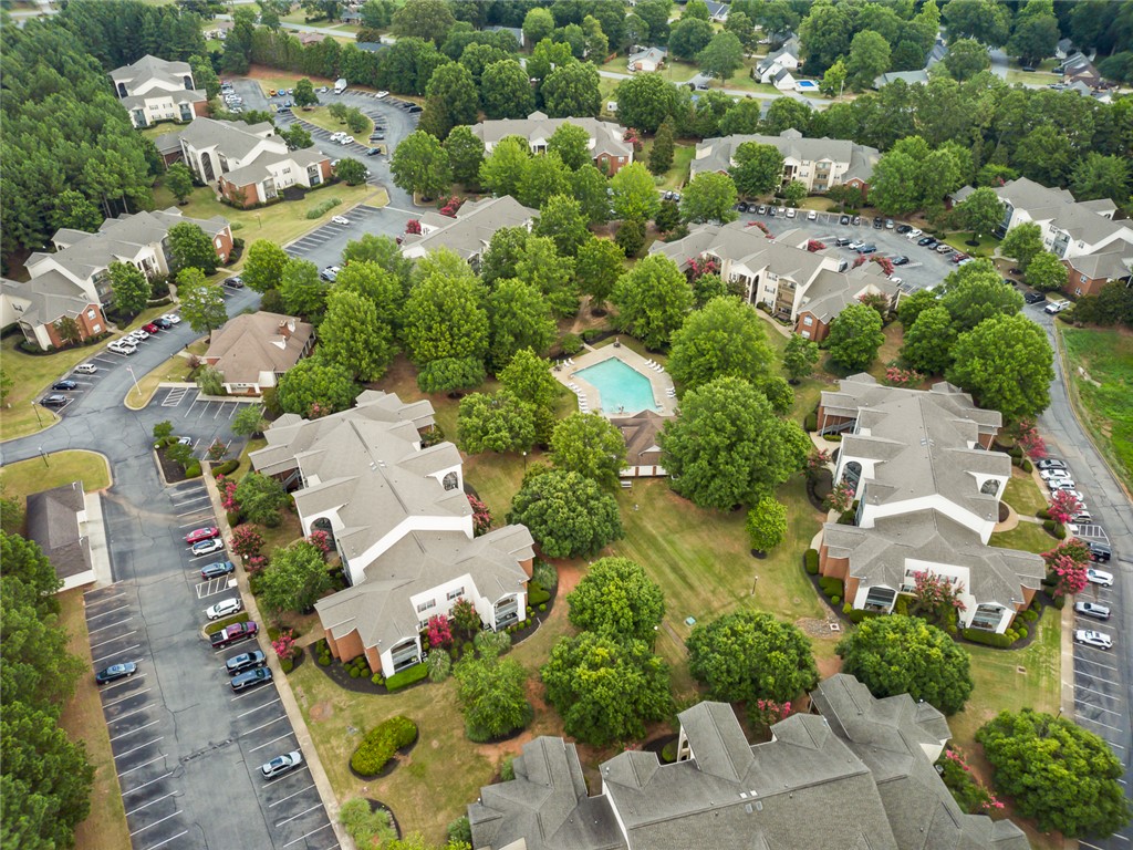 151 Wexford Drive, Unit 301 Anderson, SC 29621 - Photo 4 of 29 An aerial view showcases a vibrant community with lush landscaping and inviting outdoor amenities.