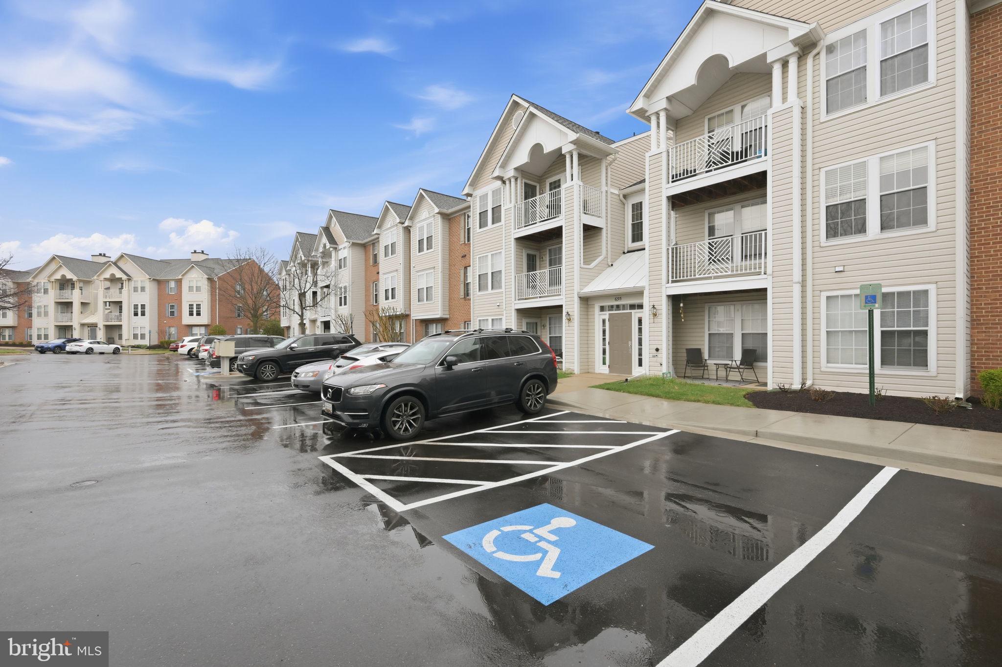 695 Winding Stream Way, Unit 301 Odenton, MD 21113 - Photo 23 of 25 a view of a building with many windows