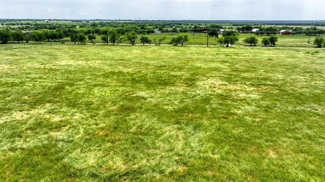 a view of a field with an outdoor space