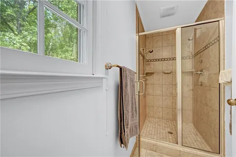 a spacious bathroom with a sink and a mirror