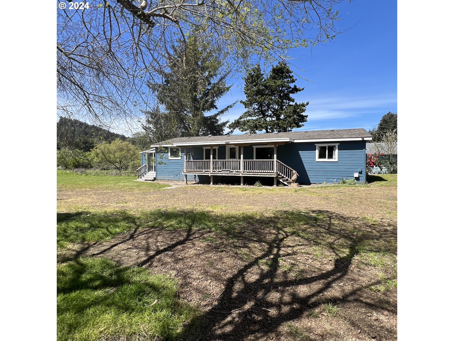 28358 Mateer Road Gold Beach, OR 97444 - Photo 41 of 48 a view of house with a yard