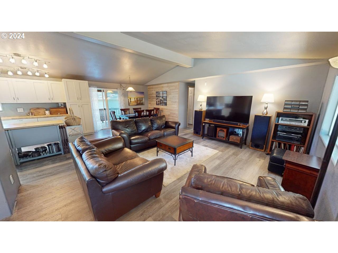 28358 Mateer Road Gold Beach, OR 97444 - Photo 5 of 48 a living room with furniture and a flat screen tv