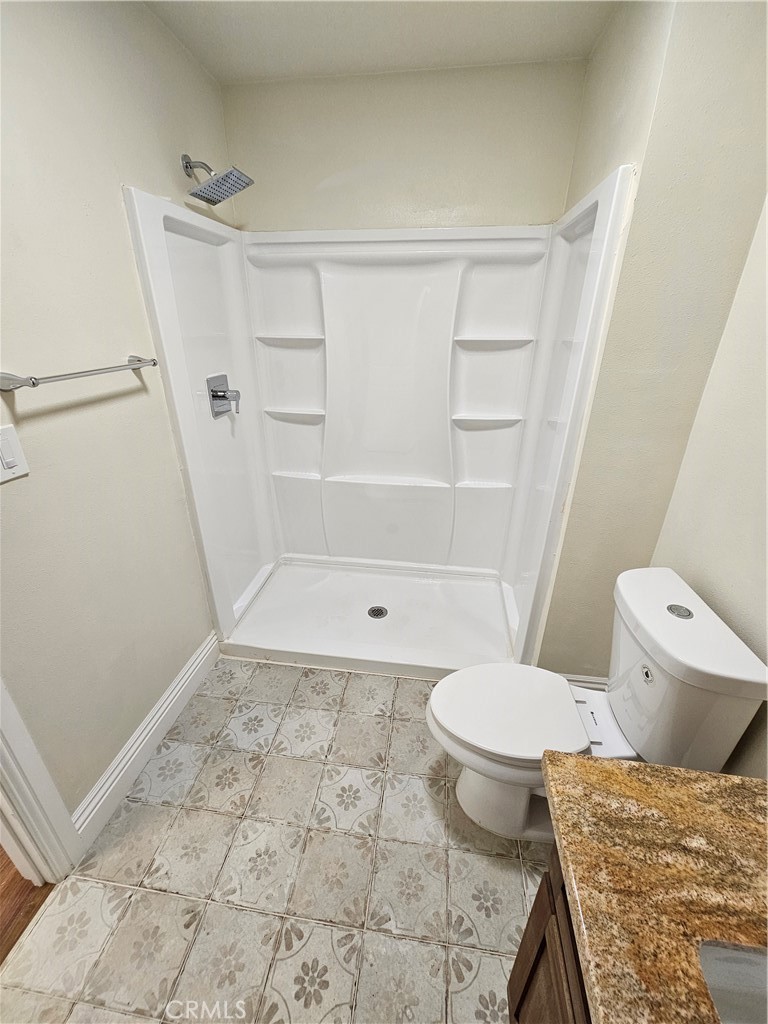 587 North Orange Street Orange, CA 92867 - Photo 12 of 15 a bathroom with a toilet and a shower