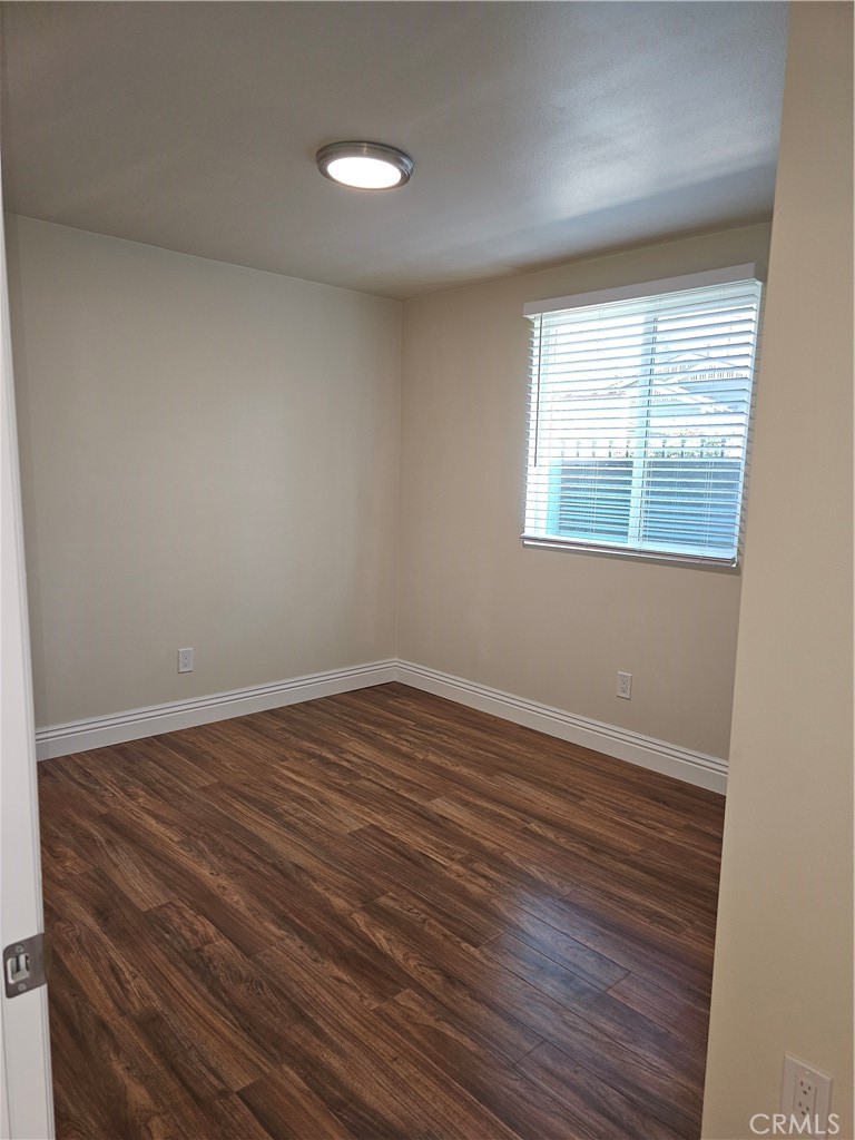 587 North Orange Street Orange, CA 92867 - Photo 7 of 15 wooden floor in an empty room with a window