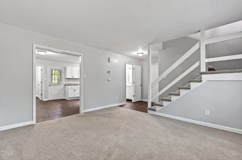 a view of entryway with wooden floor and front door