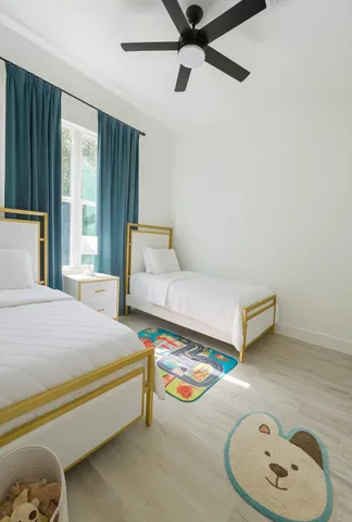 a bedroom with a bed and a chair