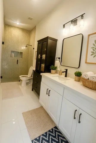 a bathroom with a sink vanity and a mirror