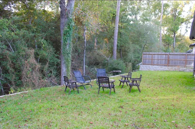 a view of a chairs in a backyard