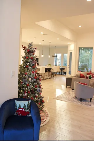 a living room with furniture and a potted plant