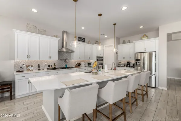 a kitchen with sink cabinets and living room view
