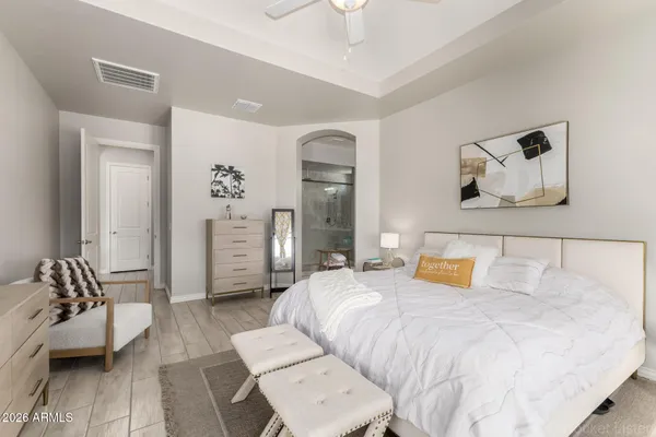 a bathroom with a sink double vanity granite tub shower and mirror