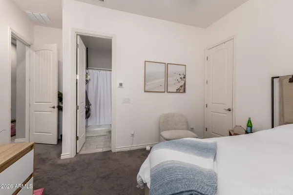 a bathroom with a sink a toilet and shower curtain