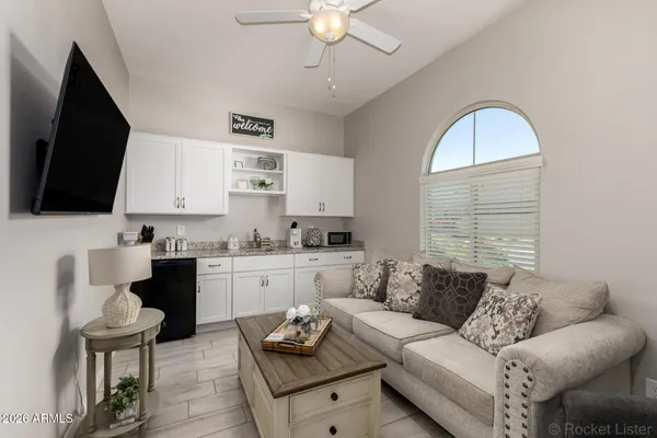a living room with furniture and a flat screen tv