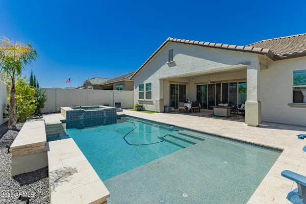 a view of a house with sitting area and couches with wooden floor