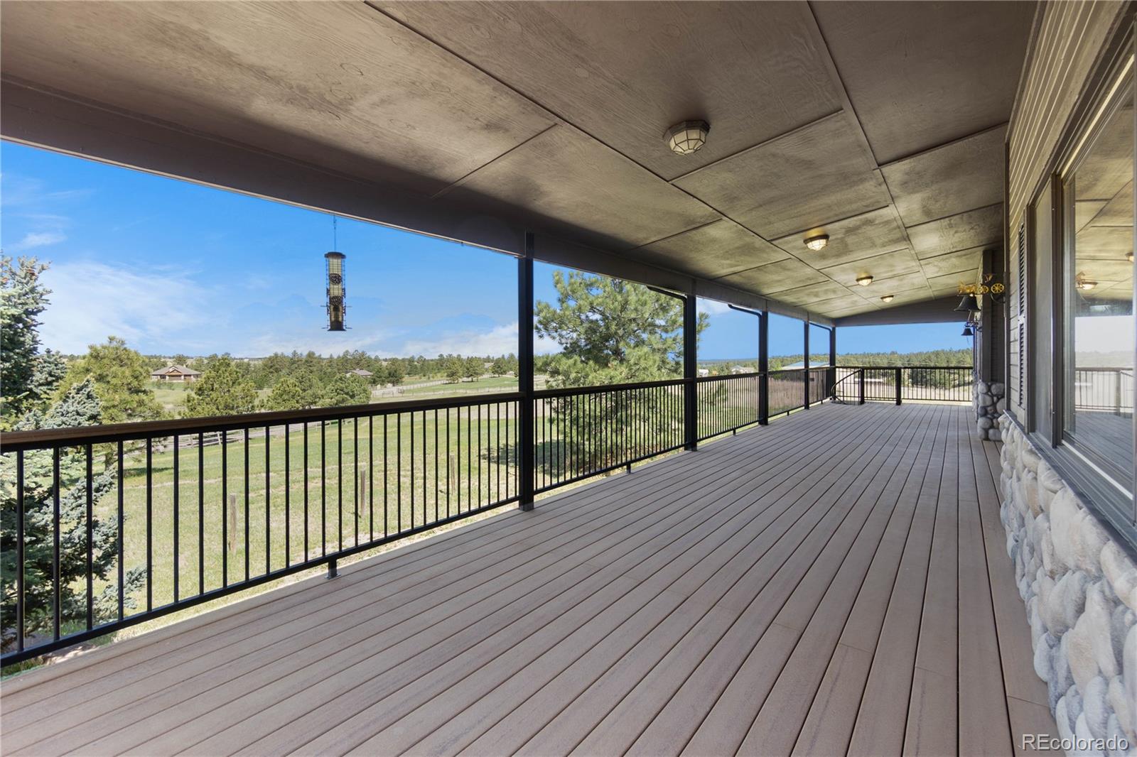74 Rocky Cliff Road Elizabeth, CO 80107 - Photo 48 of 50 a view of balcony with wooden floor
