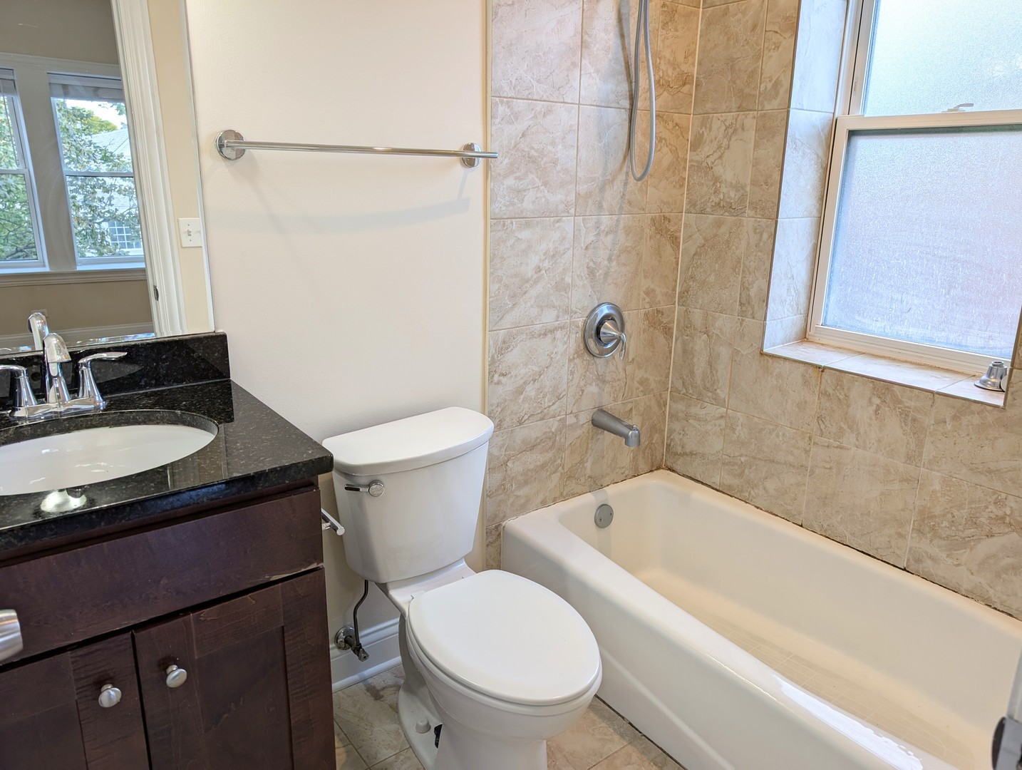 4014 North Central Park Avenue, Unit 3E Chicago, IL 60618 - Photo 8 of 11 a white toilet sitting next to a bath tub
