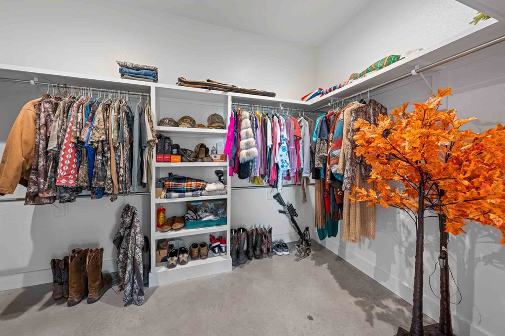 147 Gray Wolf Blanco, TX 78606 - Photo 19 of 34 a view of walk in closet with clothes and shoes