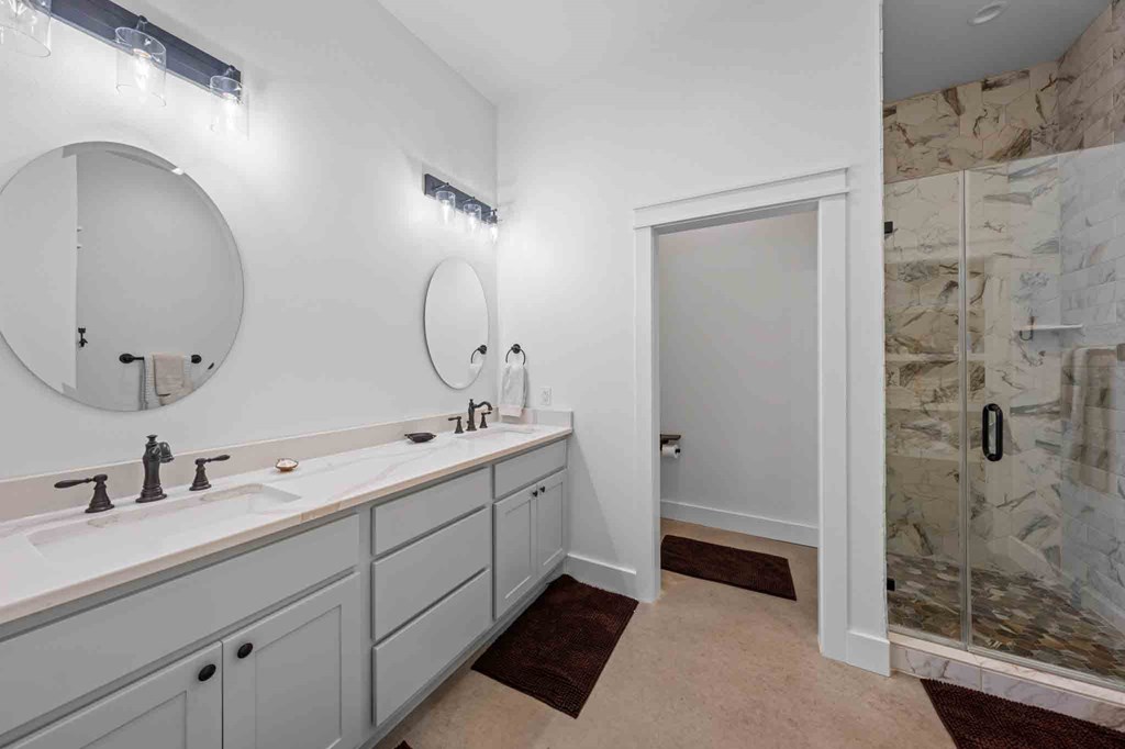 147 Gray Wolf Blanco, TX 78606 - Photo 20 of 34 a spacious bathroom with a double vanity sink mirror and shower