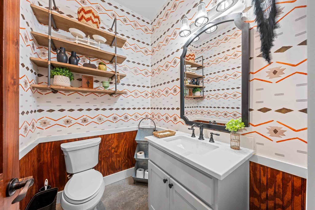 147 Gray Wolf Blanco, TX 78606 - Photo 28 of 34 a bathroom with a toilet a sink and a mirror