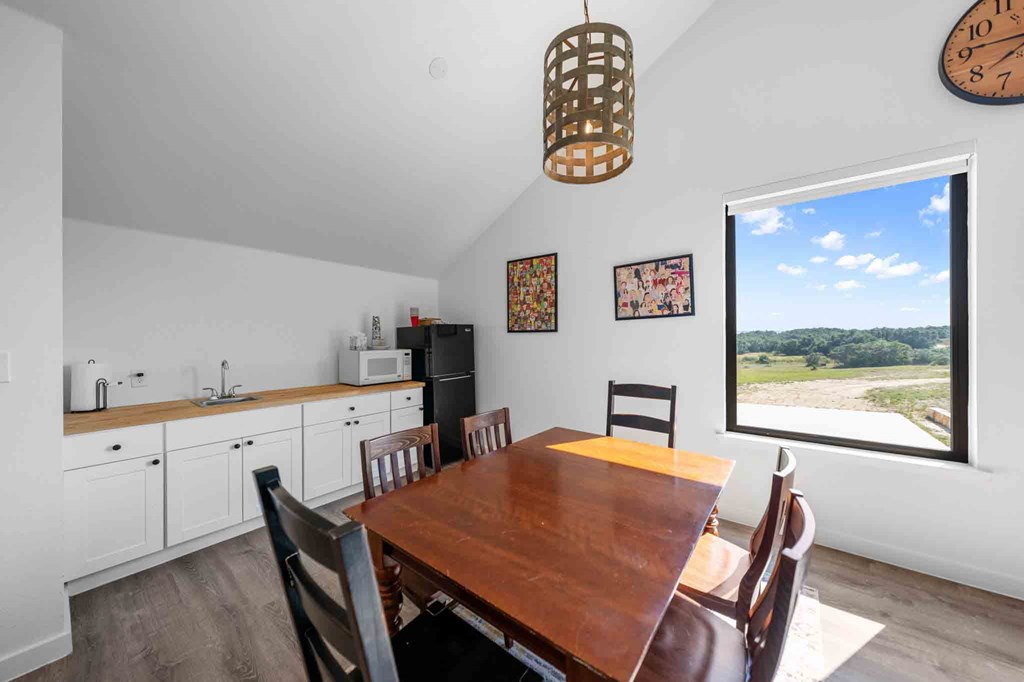 147 Gray Wolf Blanco, TX 78606 - Photo 32 of 34 a view of a dining room with furniture window and wooden floor