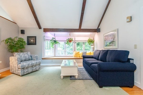 28 Register Road Marion, MA 02738 - Photo 14 of 36 a living room with furniture and a large window