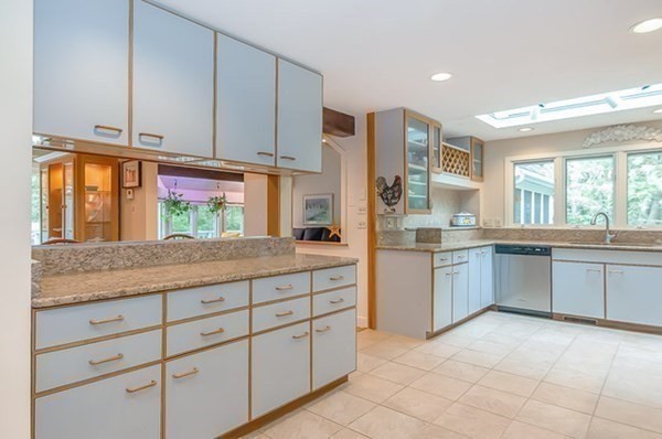 28 Register Road Marion, MA 02738 - Photo 16 of 36 a kitchen with granite countertop a stove sink and cabinets