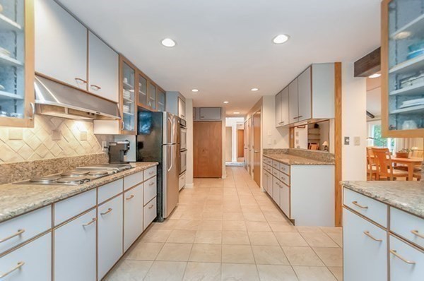 28 Register Road Marion, MA 02738 - Photo 17 of 36 a large kitchen with a large counter top appliances and cabinets
