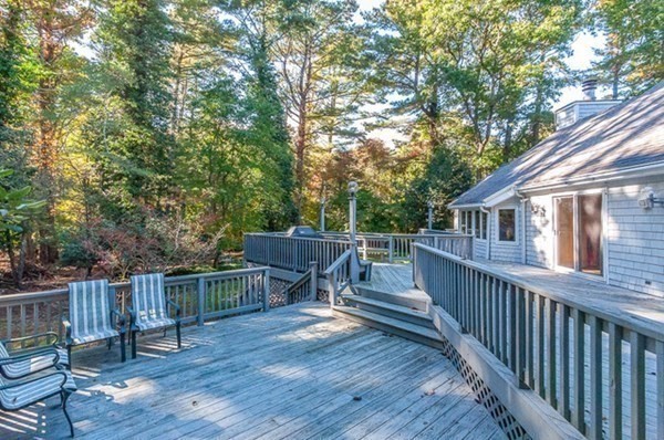 28 Register Road Marion, MA 02738 - Photo 8 of 36 a view of a deck with two chair and wooden floor