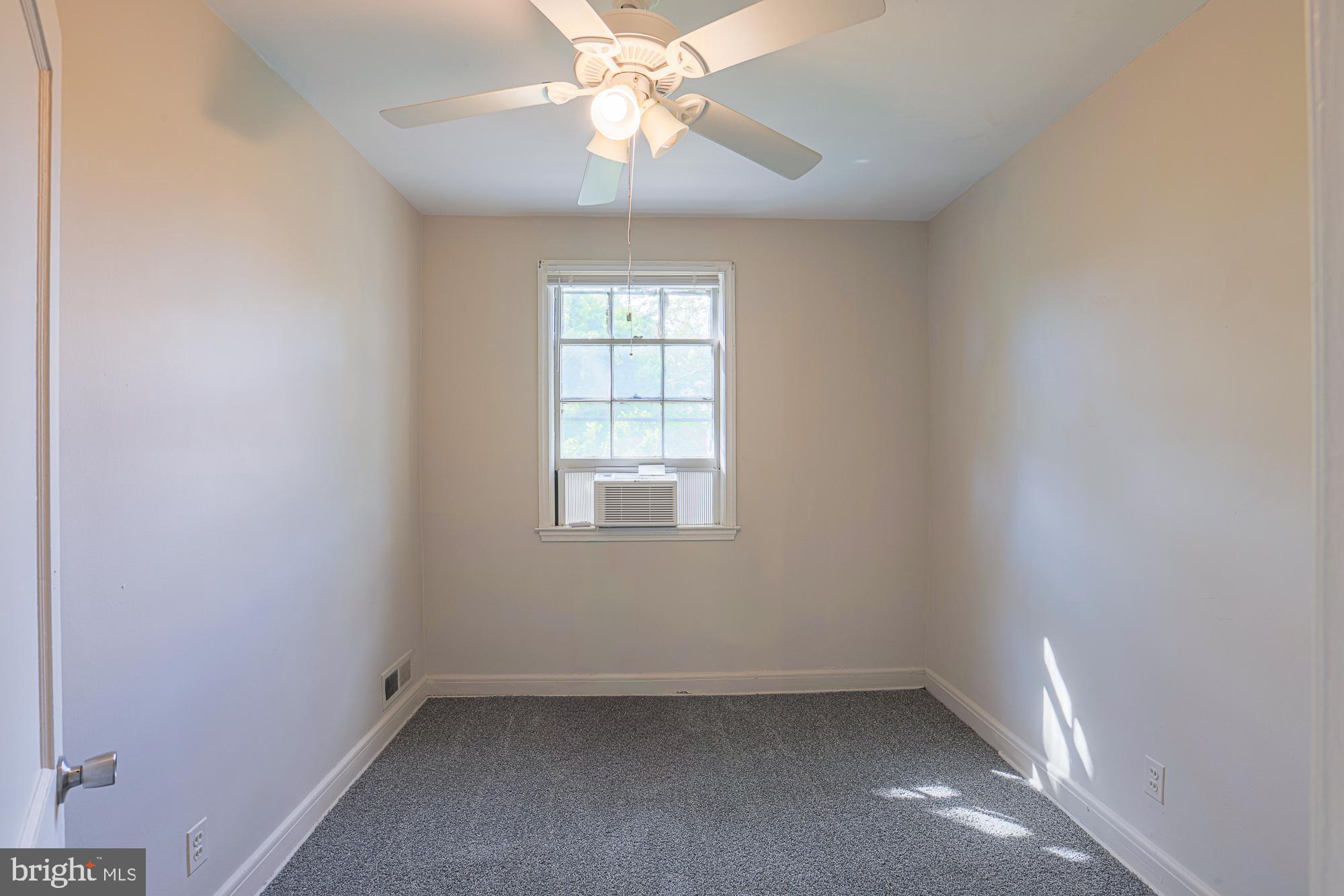 3914 Bancroft Road Baltimore, MD 21215 - Photo 16 of 25 an empty room with a window and a fan